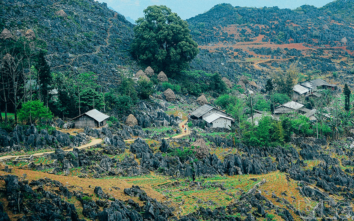 The houses of local ethnic people located among the karst plateau